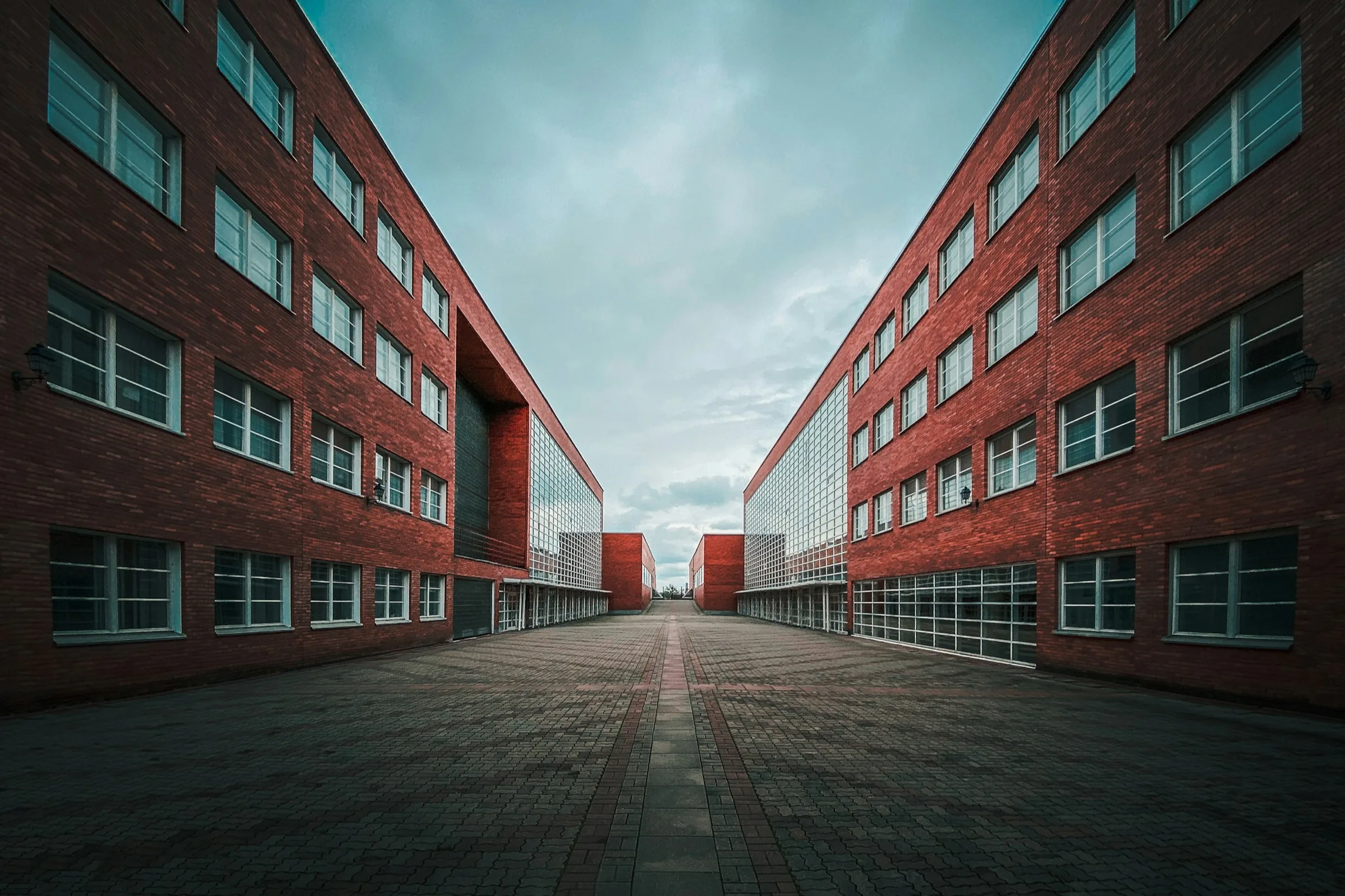 Courtyard between two long red brick wings