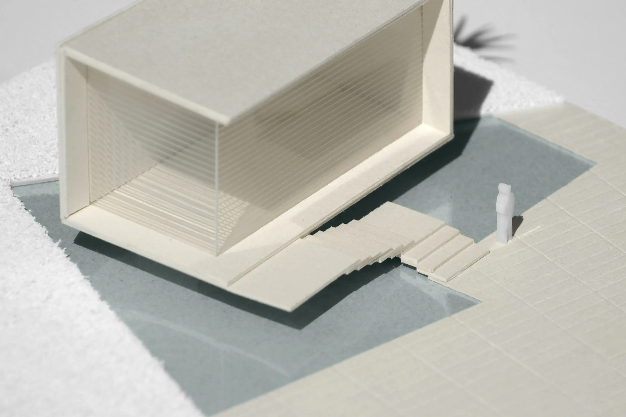 A sectional card model showing a stair and a deep window