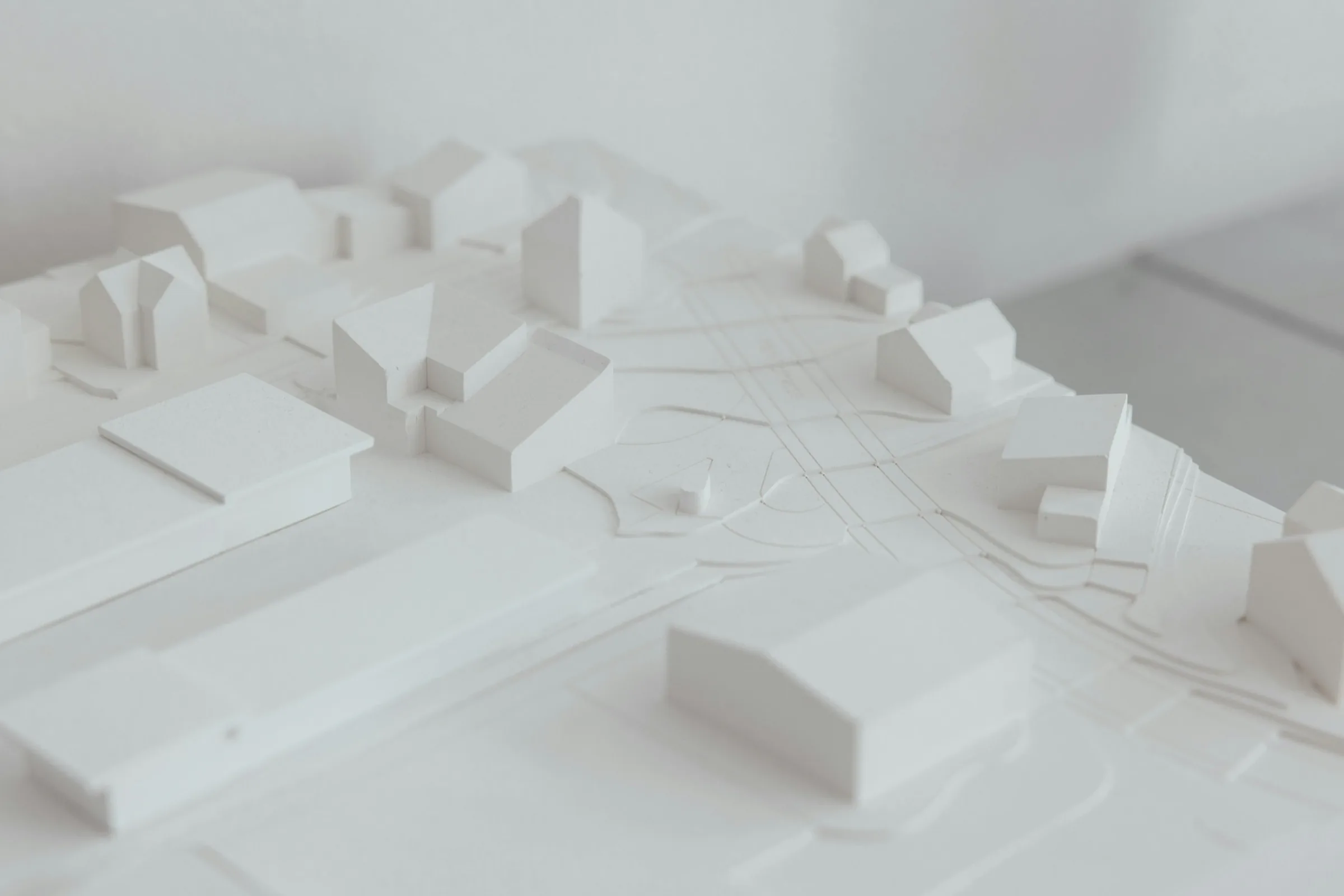 White site model of a town with houses and streets
